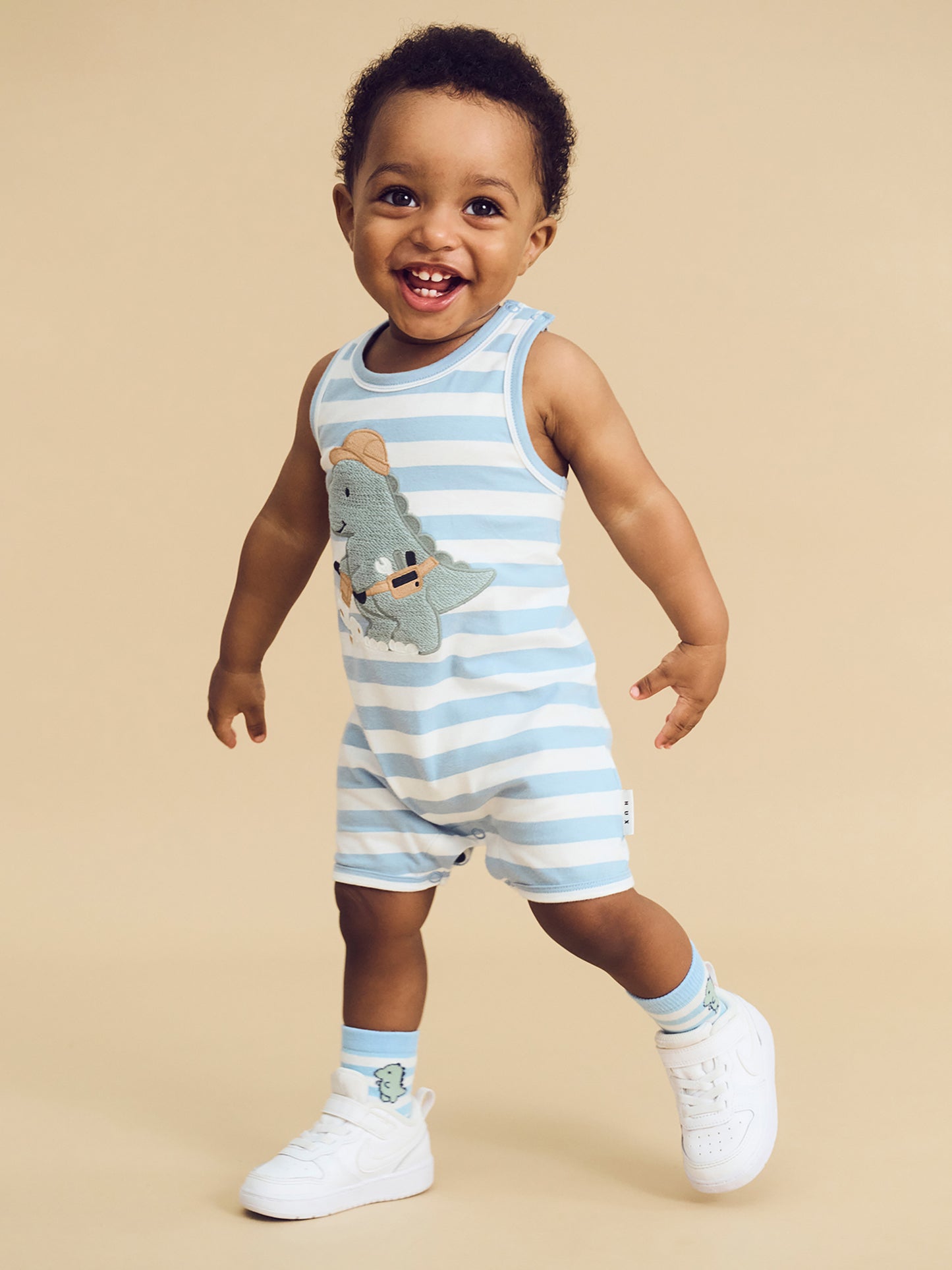 CONSTRUCTION DINO STRIPE SLEEVELESS ROMPER - MARINE BLUE/ ALMOND MILK MARINE BLUE| ALMOND MILK-