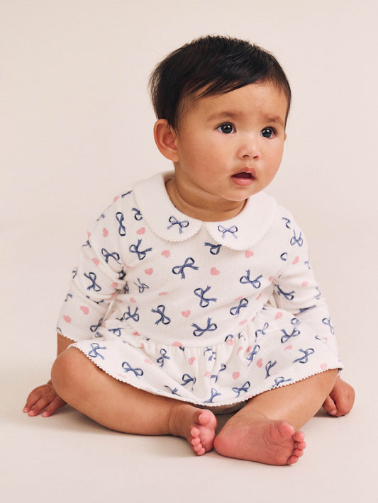 HEARTS AND BOWS ROMPER - ALMOND MILK