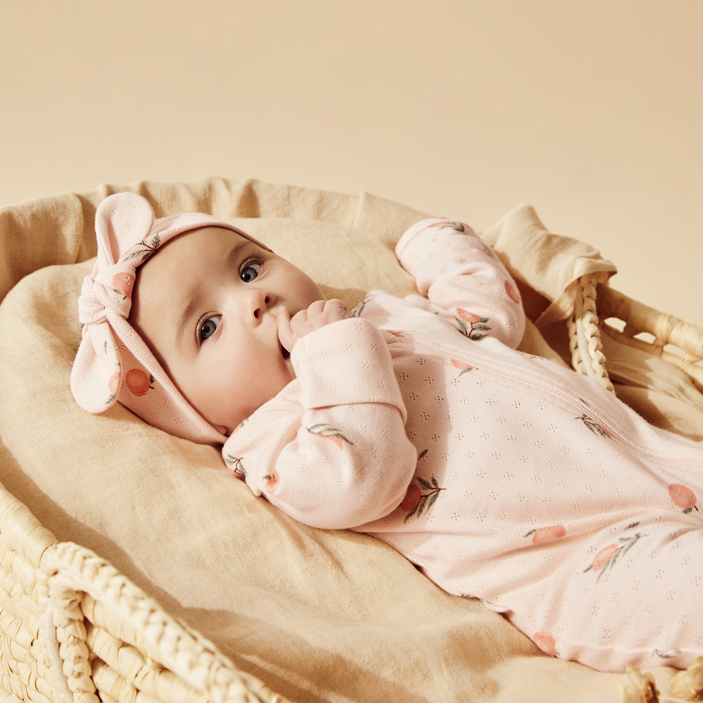 ORGANIC POINTELLE ZIPSUIT WITH FEET - PEACHES